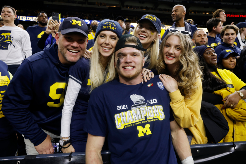 Aidan Hutchinson celebrates with his family after Michigan won the 2021 Big Ten Championship.