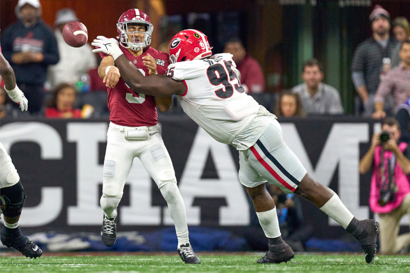 Georgia defensive end Devonte Wyatt pressures Alabama QB Bryce Young in the 2022 CFP National Championship Game.