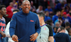 Doc Rivers smiles during a Philadelphia 76ers game.