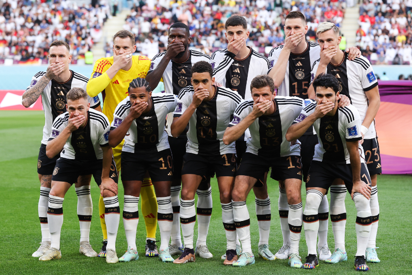Germany players cover their mouths in protest as they pose for a team photo during the FIFA World Cup Qatar 2022 Group E match between Germany and Japan