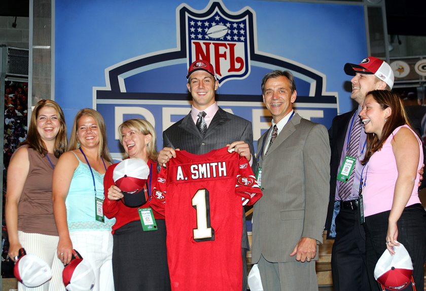 Alex Smith holds up his jersey after being drafted in 2005.