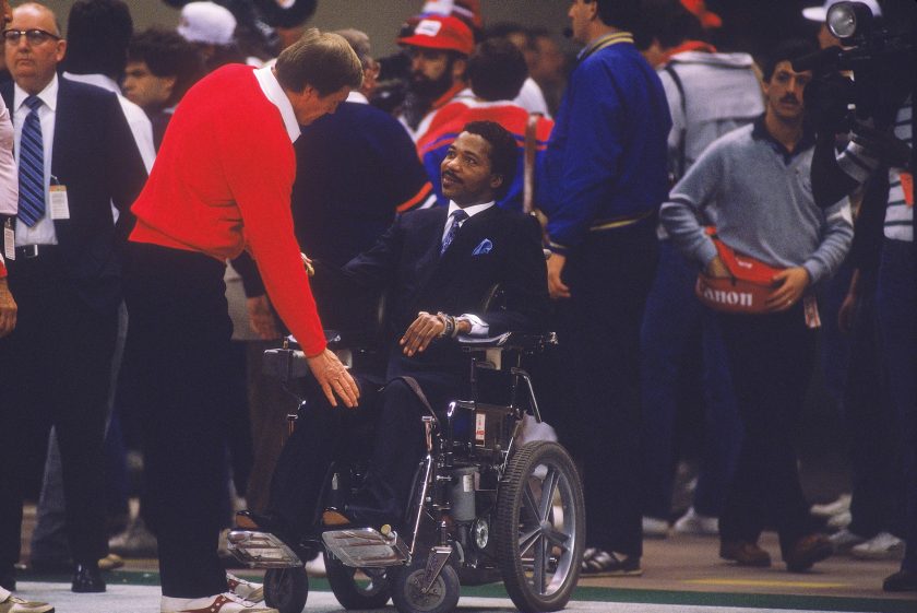 Darryl Stingley talks near the Patriot's sidelines during Super Bowl XX against the Chicago Bears at the Superdome on January 26, 1986.
