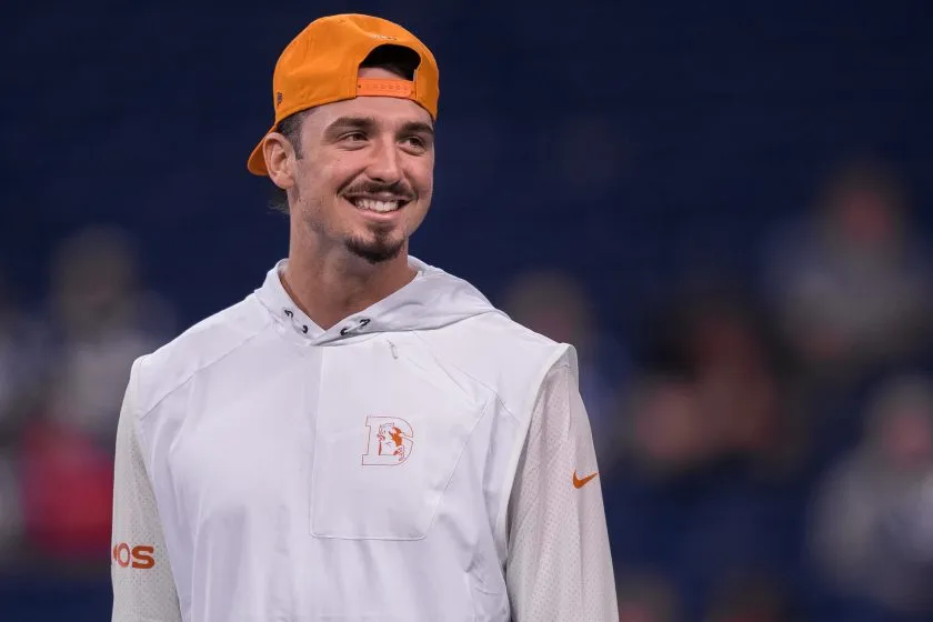 Paxton Lynch smiles before a Broncos game in 2017.