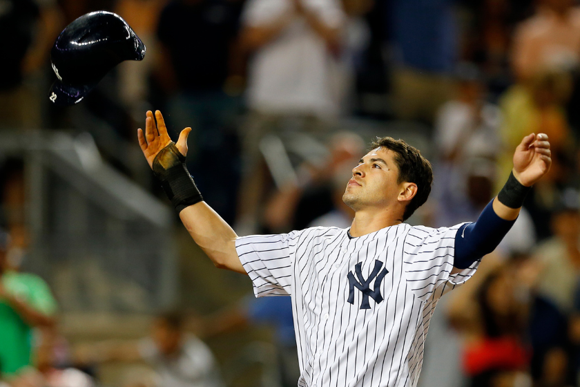 Jacoby Ellsbury #22 of the New York Yankees reacts by throwing his helmet in the air after finding out the the run he scored on a stolen base and a two base error were nullified because teammate Mark Teixeira #25 was out looking at a called third strike