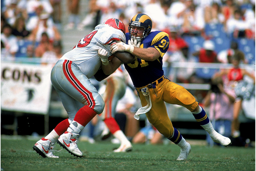 Los Angeles Rams star Kevin Greene rushes the quarterback against the Atlanta Falcons.