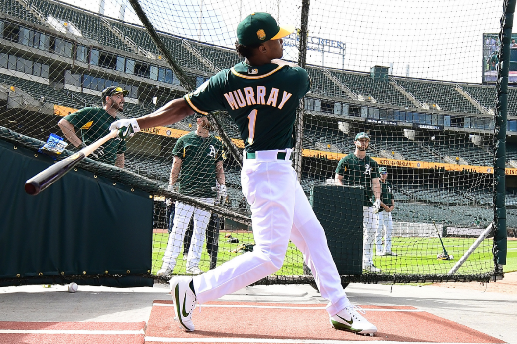 Kyler Murray takes batting practice at the Oakland Colliseum