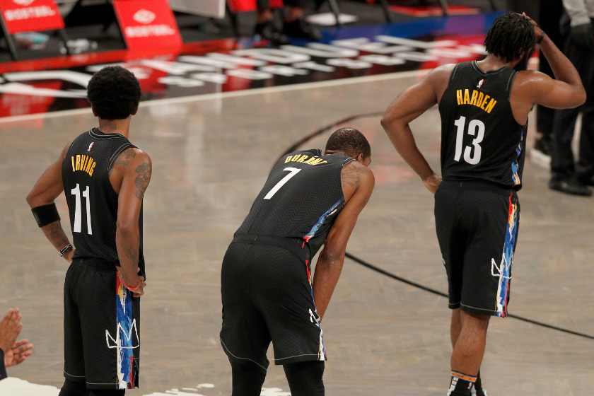 Kevin Durant, Kyrie Irving and James Harden  during a stoppage in play of a Brooklyn Nets game.