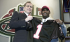 Michael Vick holds his jersey after being drafted in 2001.
