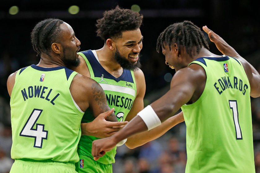 Norm Powell, Anthony Edwards and Karl-Anthony Towns celebrate a big play for the Timberwolves