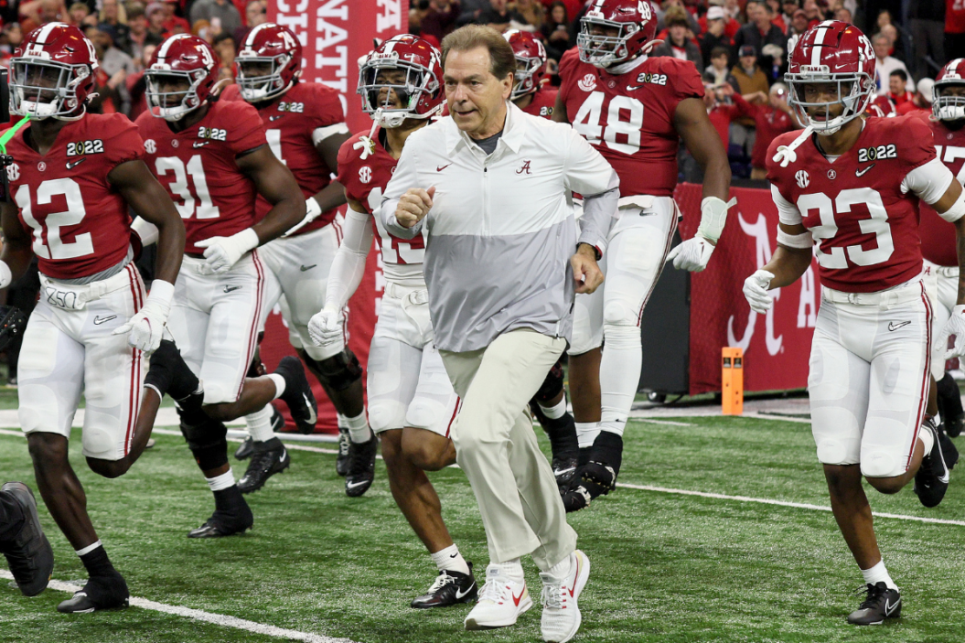 Nick Saban takes the field with his Alabama Team