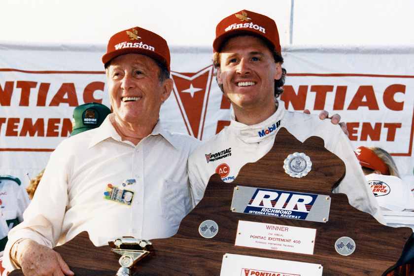 Track owner Paul Sawyer (L) with driver Rusty Wallace (R) in victory lane after Wallace won the Pontiac Excitement 400 NASCAR Cup race at Sawyer's Richmond International Raceway