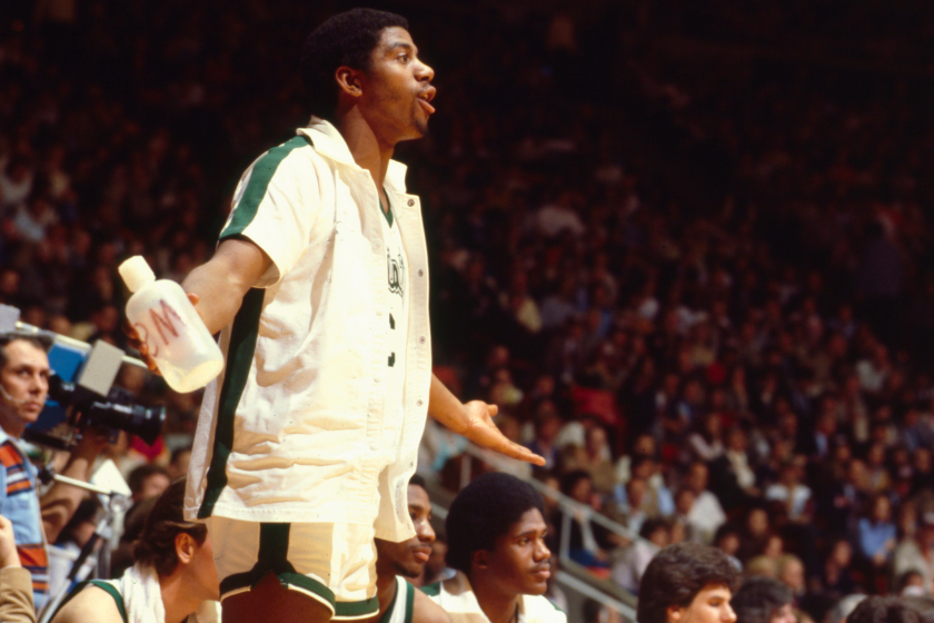 Magic Johnson argues a call from the Michigan State bench.