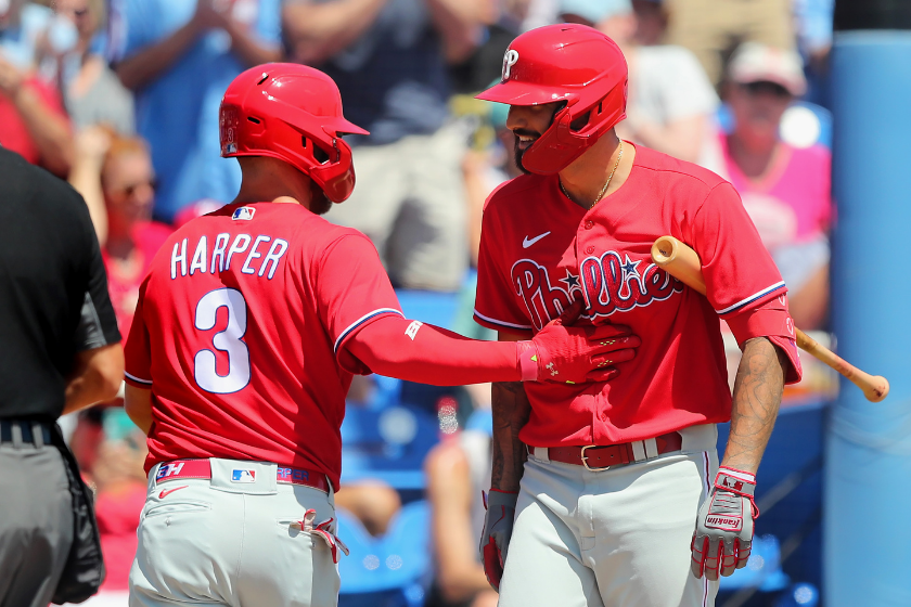 Bryce Harper and Nick Castellanos celebrate a good play for the Phillies
