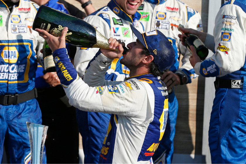 Chase Elliott celebrates with crew members in Victory Lane after winning the Monster Energy NASCAR Cup Series Go Bowling at The Glen at Watkins Glen International on August 04, 2019 in Watkins Glen, New York