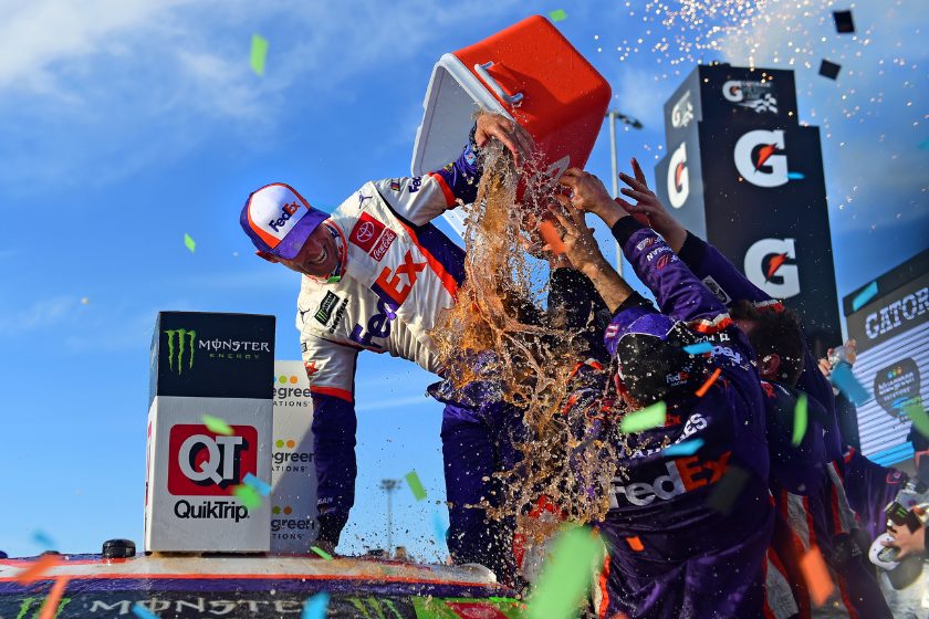 Denny Hamlin celebrates in Victory Lane after winning the Monster Energy NASCAR Cup Series Bluegreen Vacations 500 at ISM Raceway on November 10, 2019 in Avondale, Arizona