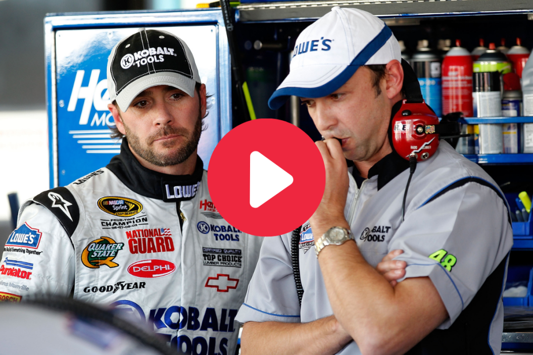 Jimmie Johnson stands in the garage with his crew chief, Chad Knaus during practice for the NASCAR Sprint Cup Series Kobalt Tools 500 at Phoenix International Raceway on November 12, 2010 in Avondale, Arizona