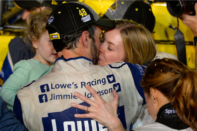 Jimmie Johnson celebrates with his wife Chandra in Victory Lane after winning the NASCAR Sprint Cup Series Ford EcoBoost 400 and the 2016 NASCAR Sprint Cup Series Championship at Homestead-Miami Speedway on November 20, 2016 in Homestead, Florida. Johnson wins a record-tying 7th NASCAR title