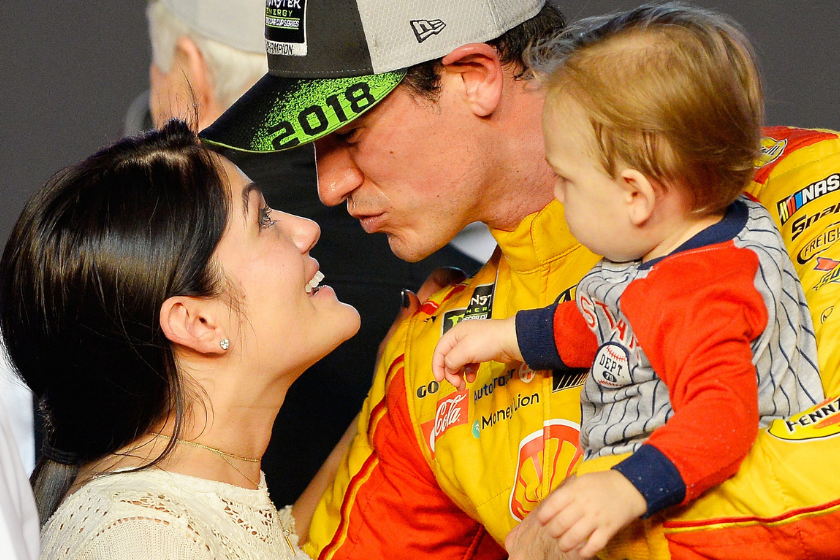 Joey Logano celebrates with his wife, Brittany, and son, Hudson, after winning the Monster Energy NASCAR Cup Series Ford EcoBoost 400 at Homestead-Miami Speedway on November 18, 2018 in Homestead, Florida