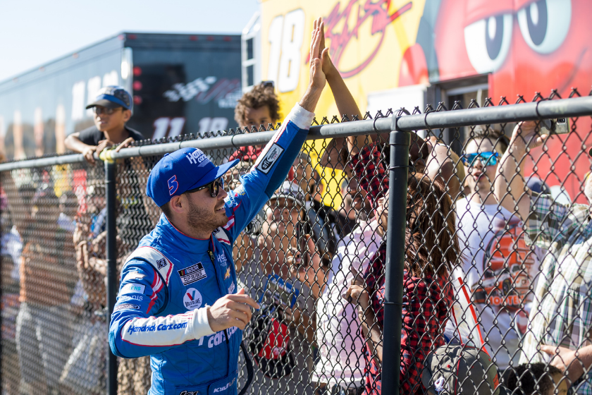 Kyle Larson high-fives fans over the fence after the NASCAR Cup Series Toyota/Save Mart 350 on June 6, 2021 at Sonoma Raceway in Sonoma, CA