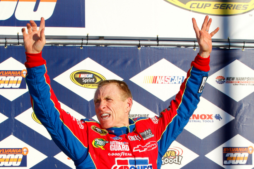 Mark Martin celebrates in victory lane after winnng the NASCAR Sprint Cup Series Sylvania 300 at the New Hampshire Motor Speedway on September 20, 2009 in Loudon, New Hampshire