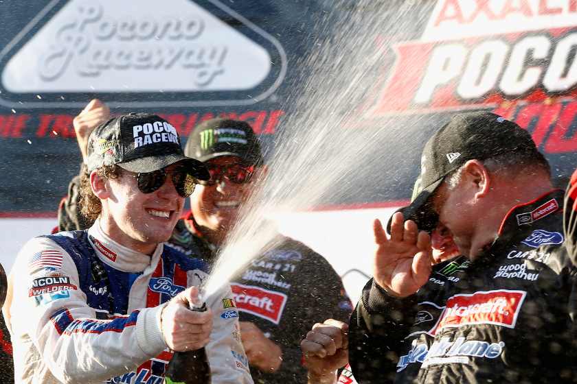 Ryan Blaney celebrates in Victory Lane after winning the Monster Energy NASCAR Cup Series Axalta presents the Pocono 400 at Pocono Raceway on June 11, 2017 in Long Pond, Pennsylvania