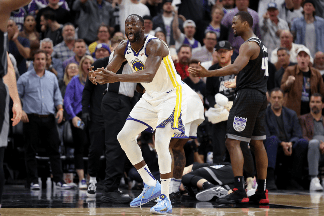 Draymond Green (right) #23 of the Golden State Warriors reacts after he got tangled with Domantas Sabonis #10 of the Sacramento Kings in the second half during Game Two of the Western Conference First Round Playoffs at Golden 1 Center