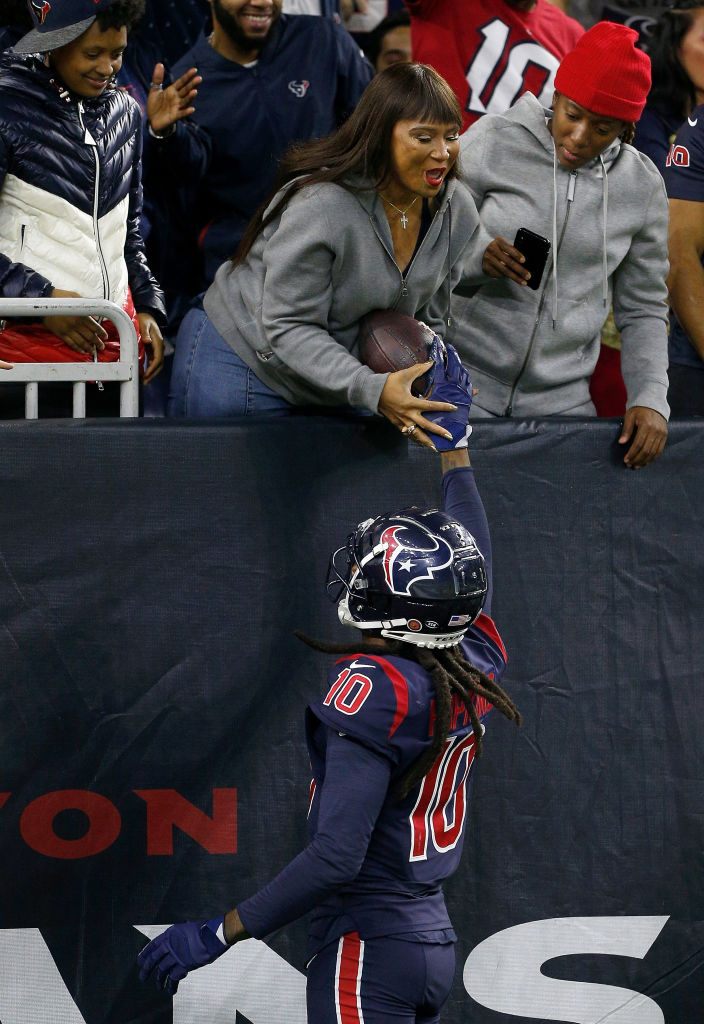 Former Houston Texans wide receiver Deandre Hopkins gives the ball to his mother after scoring touchdown.