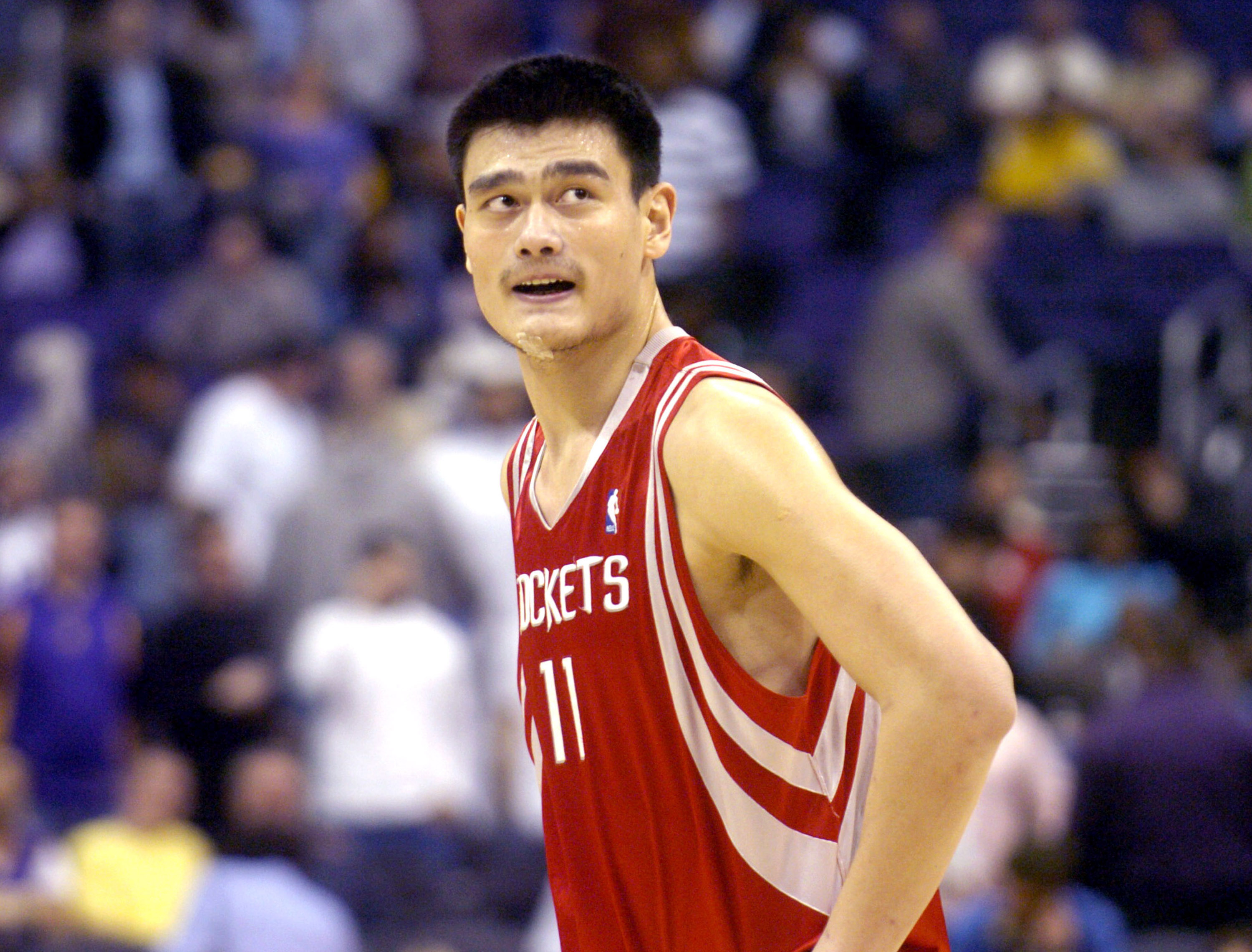 Yao Ming of the Western Conference All-Stars and Michael Jordan of News  Photo - Getty Images
