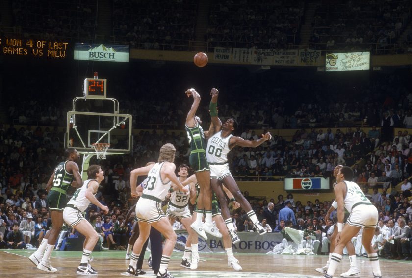 Players jump during tipoff during a 1987 Celtics-Bucks playoff game.