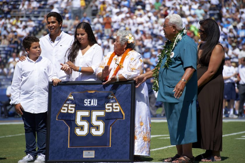 Junior Seau's family before a game in 2012.
