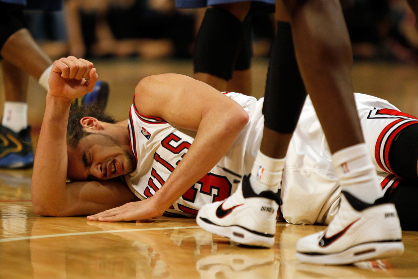 Joakim Noah lays on the floor after suffering an injury