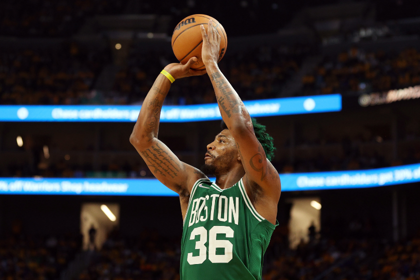 Boston Celtics point guard Marcus Smart shoots a three-pointer against the Golden State Warriors in Game 1 of the NBA Finals.