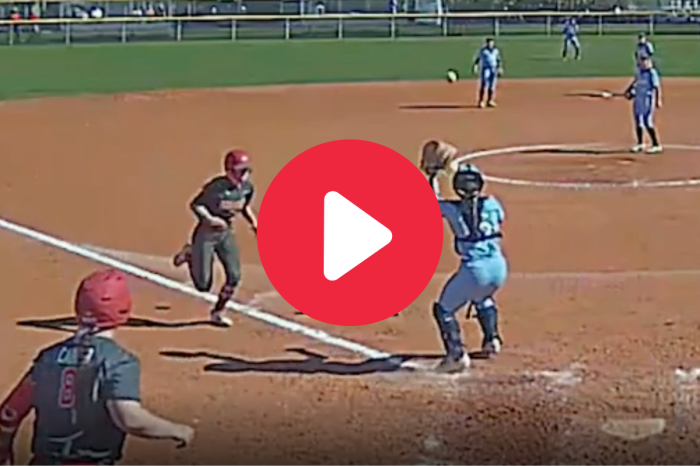 Tough Softball Catcher Hangs On in Controversial Collision