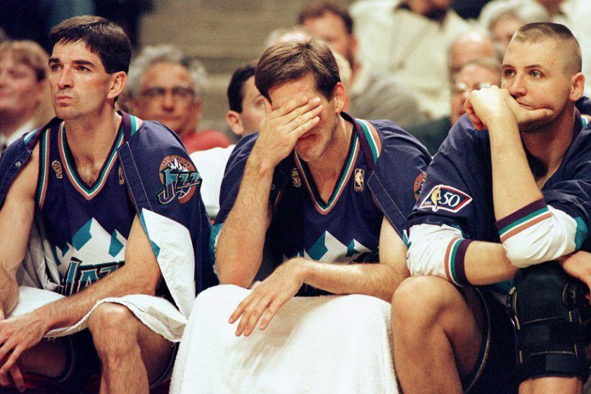 John Stockon, Jeff Hornacek and Greg Ostertag watch from the becnh as the Chicago Bulls blowout the Utah Jazz