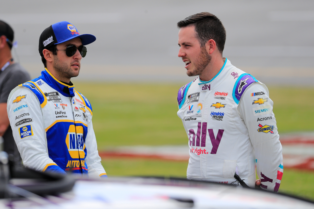 Chase Elliott talks with Alex Bowman before the running of the NASCAR Cup Series GEICO 500 race on April 24, 2022 at Talladega Superspeedway in Talladega, Alabama