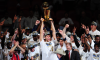 Dirk Nowitzki hoists the Larry O'Brien Trophy after the Dallas Mavericks win the 2011 NBA championship.