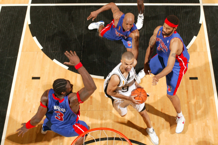 Ben Wallace, Chauncey Billups and Rasheed Wallace converge on Spurs guard Tony Parker