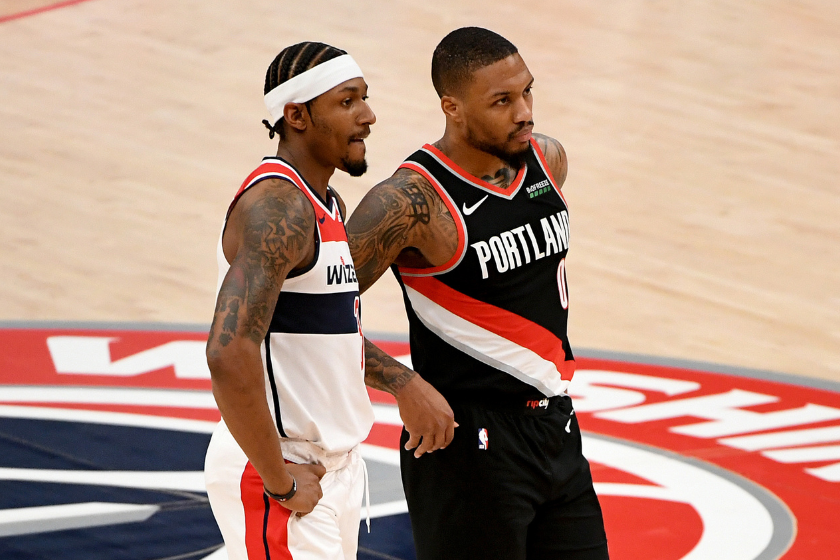 Washington Wizards star Bradley Beal and Portland Trail Blazers star Damian Lillard lok on during a game at the Capital One Arena