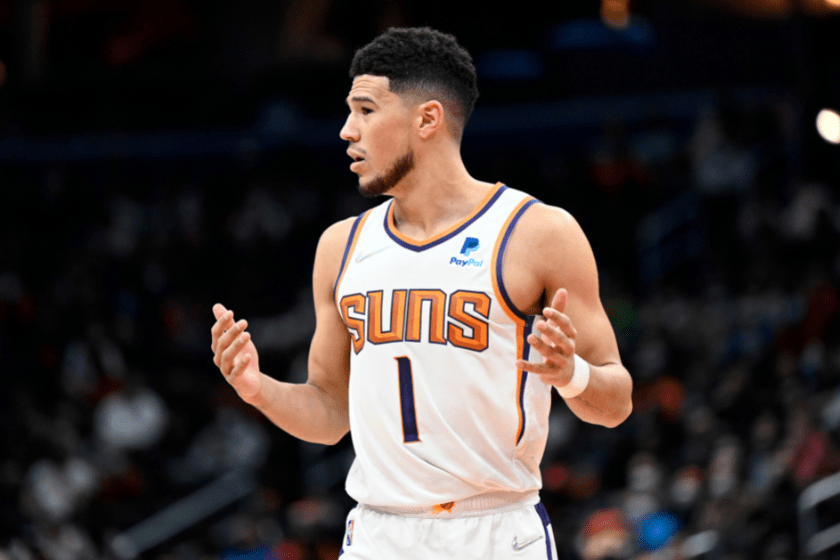 Devin Booker reacts to a call