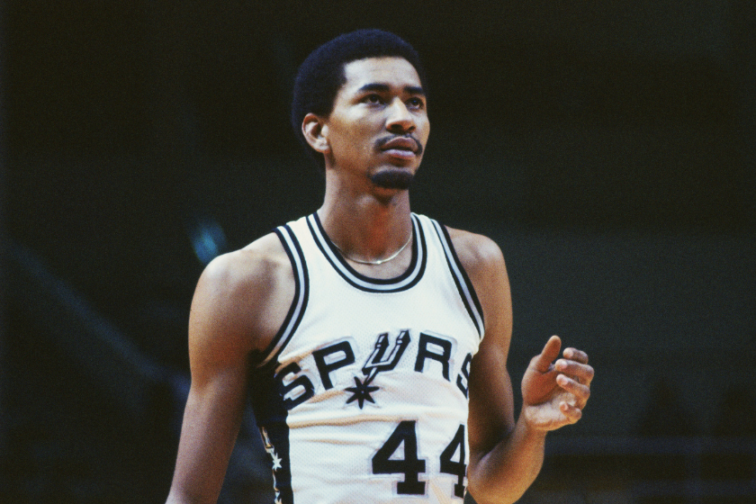 George Gervin during a stoppage in play during a Spurs game.