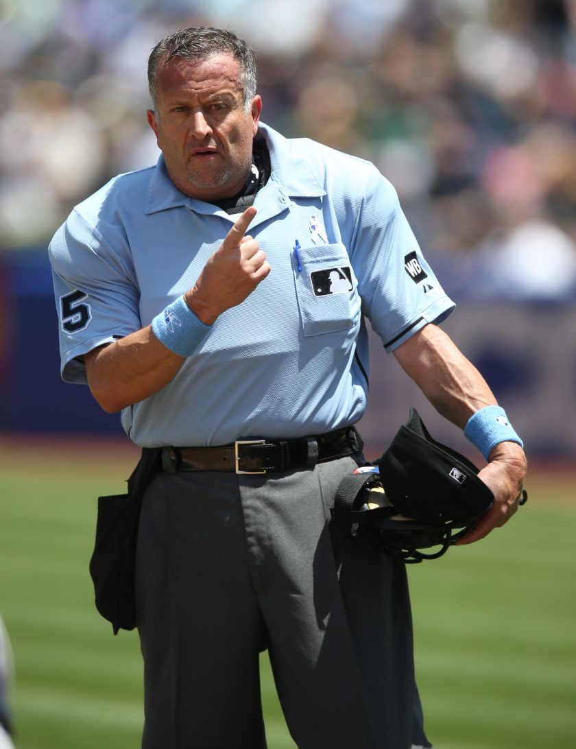 Dale Scott umpires a game in 2014.