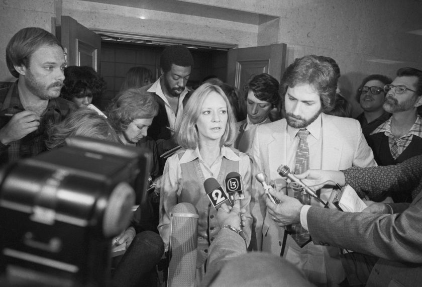 Outside the courtroom, the press interviews Marilyn Barnett, accompanied by her lawyer, Joel Ladin, in 1981.