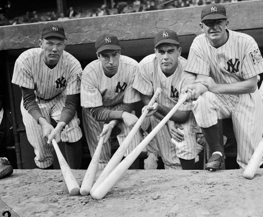 Members of the 1939 Yankees holds bats for a photo