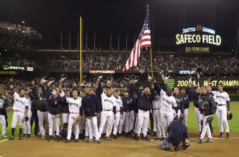 The 2001 Mariners celebrate after winning a game.