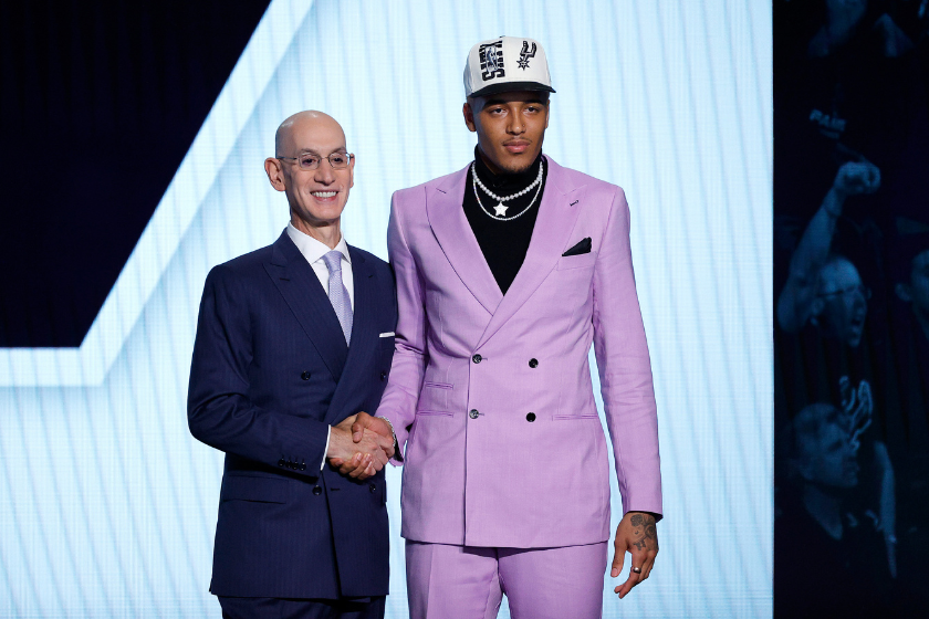 Jeremy Sochan shakes the hand of NBA Commissioner Adam Silver after being drafted by the San Antonio Spurs.