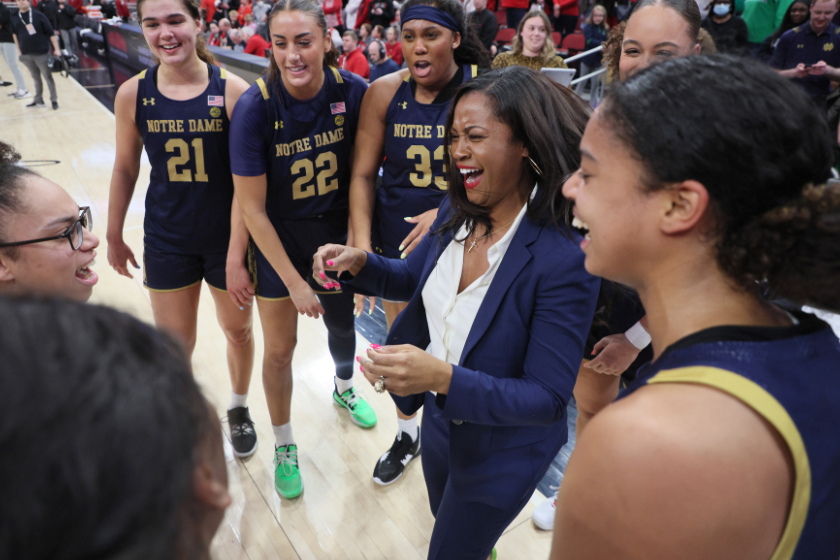 Niele Ivey the head coach of the Notre Dame Fighting Irish celebrate after the 68-65 win over theLouisville Cardinals against the at KFC YUM! Center