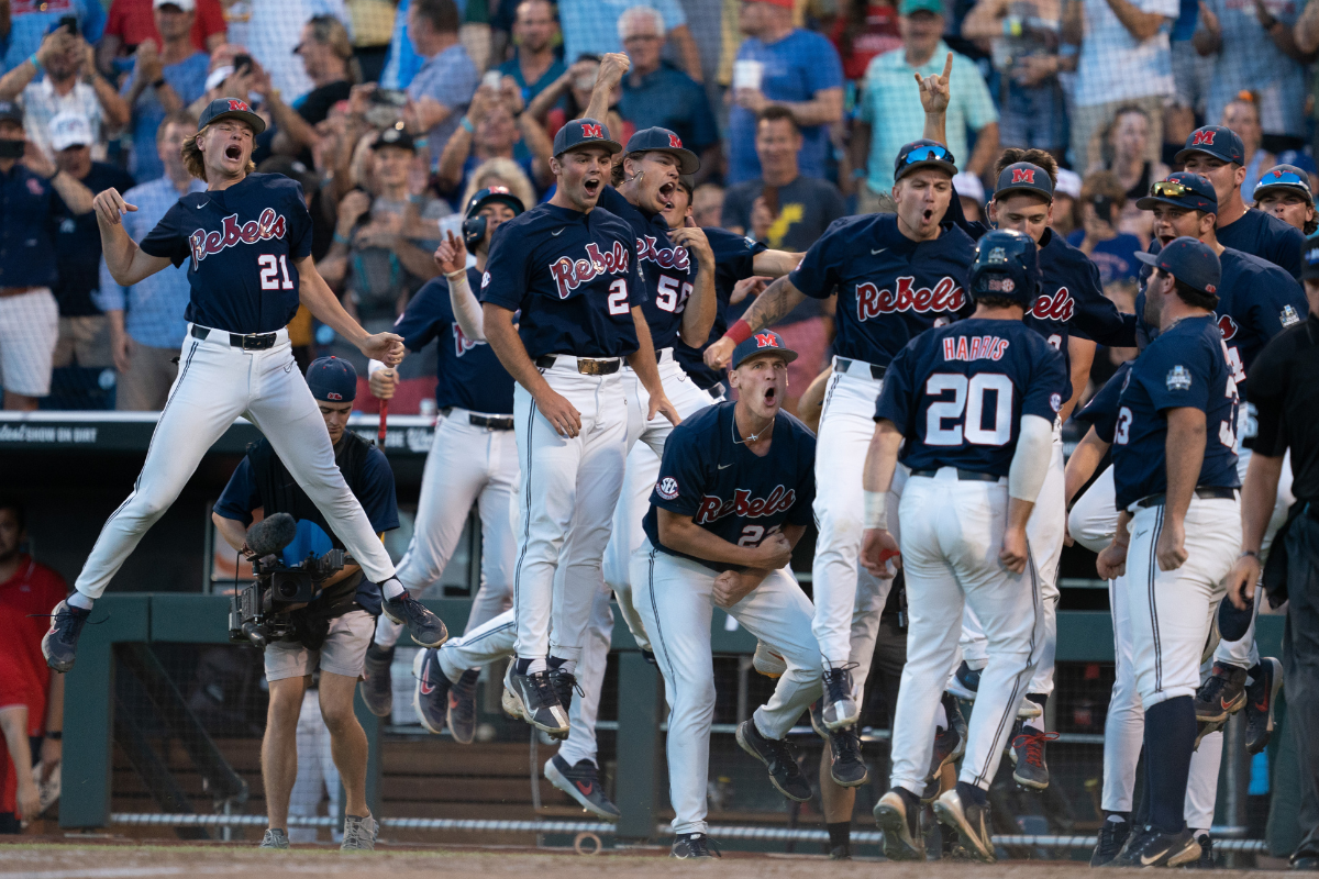 Ole Miss reacts to a home run in the College World Series