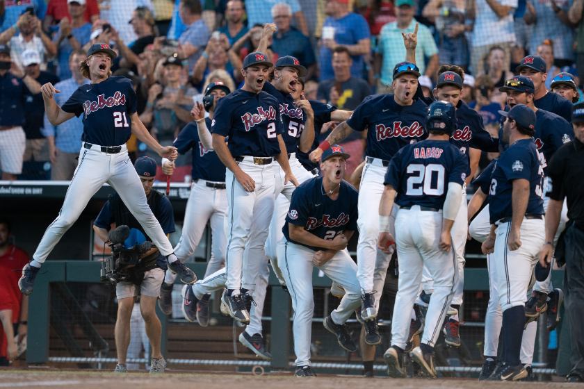 Ole Miss reacts to a home run in the College World Series
