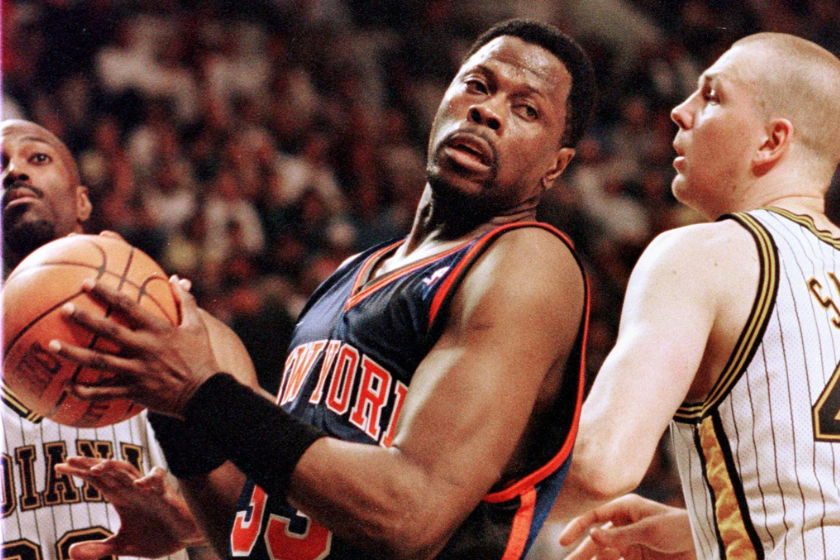 Patrick Ewing works into position against Rick Smits