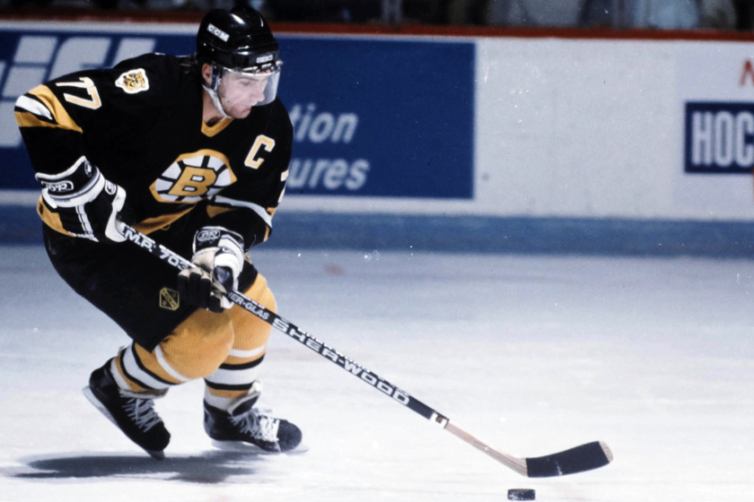 Ray Bourque handles the puck for the Boston Bruins.